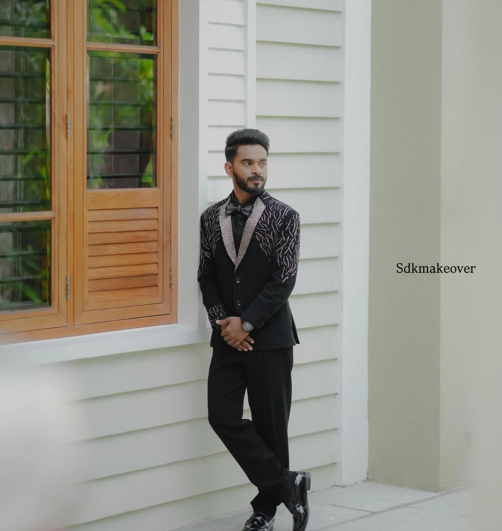Groom in black embellished blazer