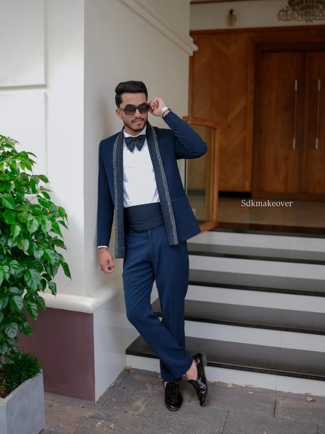 Groom in white three-piece suit
